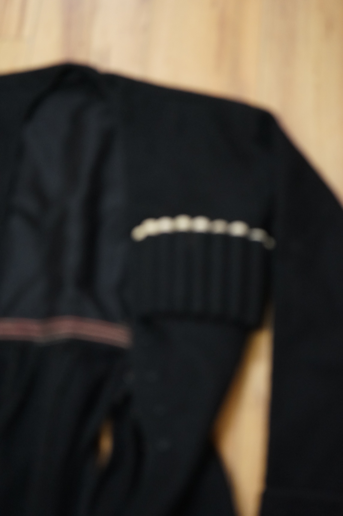 A theatrical gents black wool coat, with unusual pocket detail. 120cm long